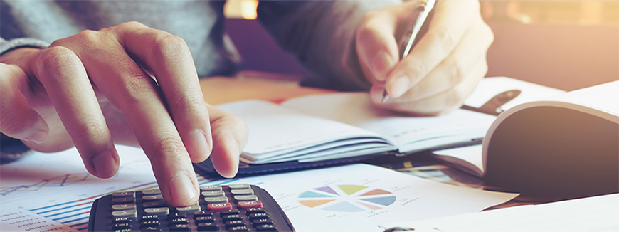 Close up hand man doing finance and calculate on desk about cost at home office.